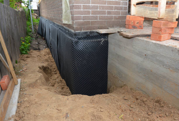 Happy homeowners after waterproofing job in Rainbow City